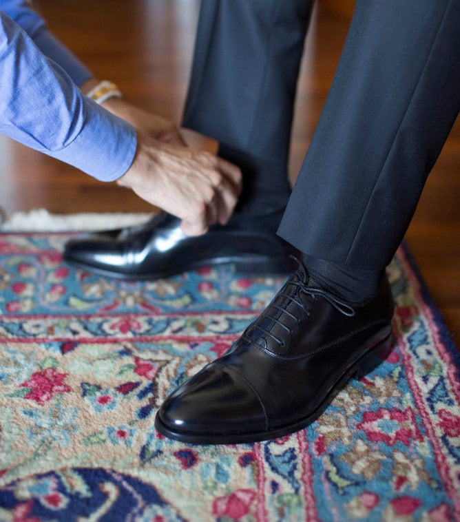 Man Fitting Leather Shoes